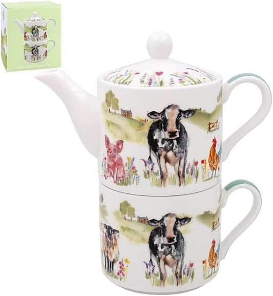 Teapot and mug set with farm animal design on a white background
