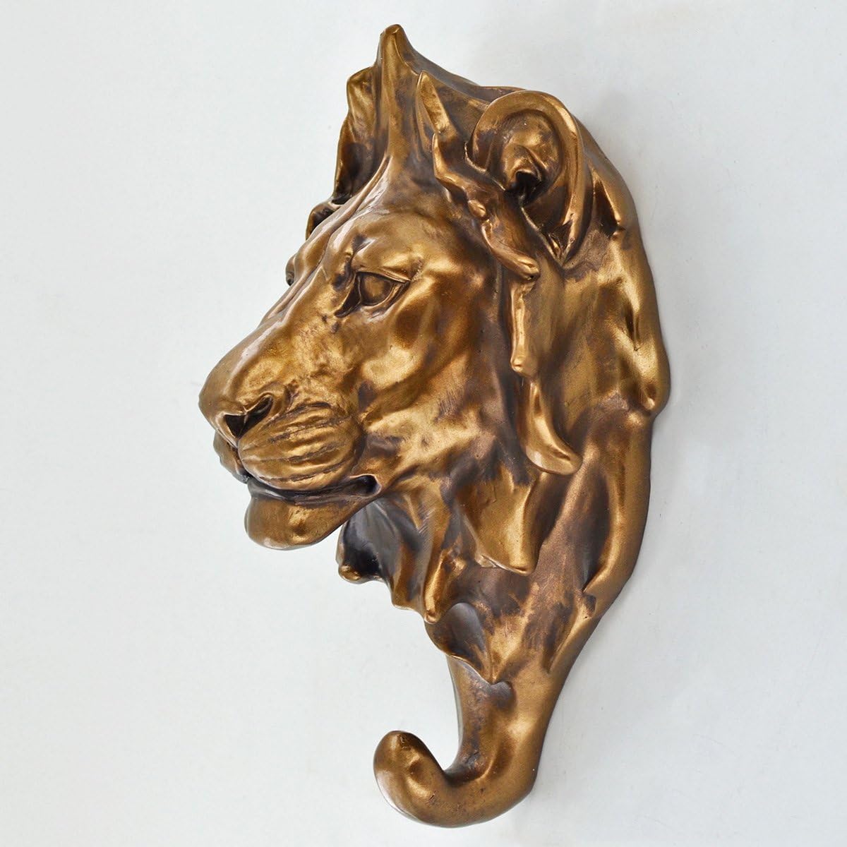 Bronze lion head sculpture on a white background