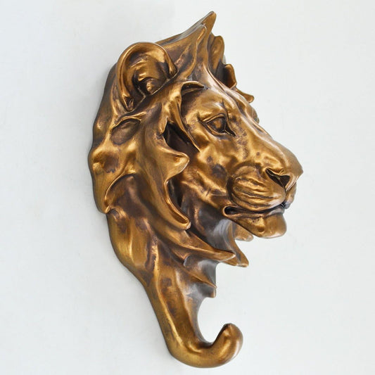 Bronze lion head sculpture on a white background
