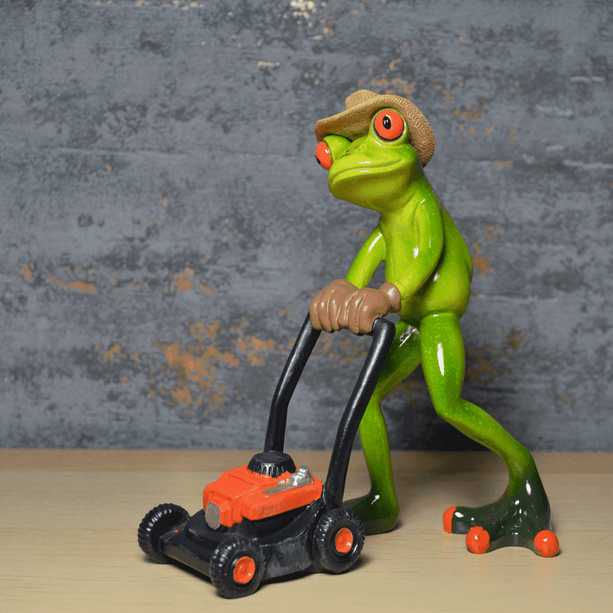 Comical Frogs Gardener With Lawn Mower Small Resin Figurine