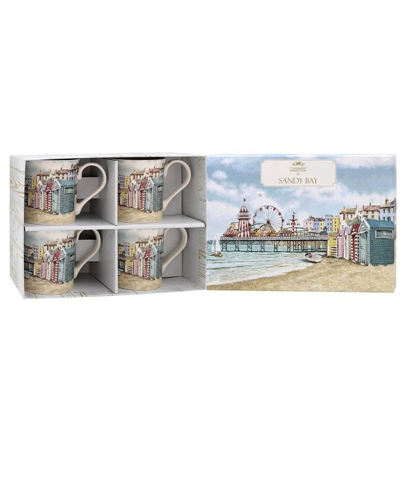 Set of four mugs in a box with a scenic design on a white background