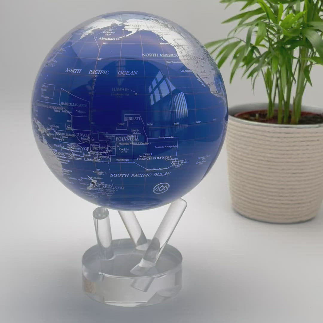 Video of a rotating blue and silver globe on a three pronged stand