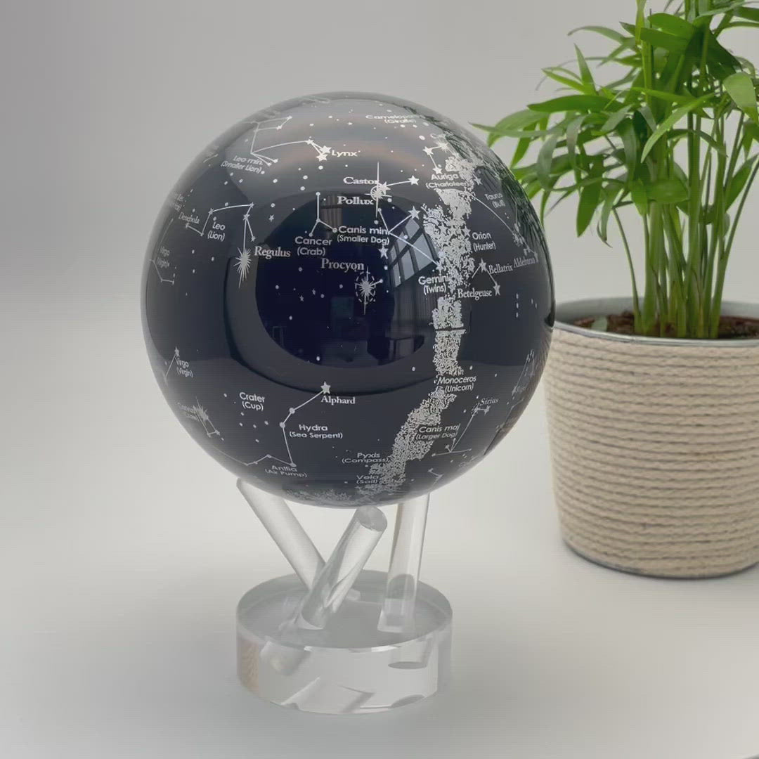 globe with constellations rotating by solar power on a three prong stand