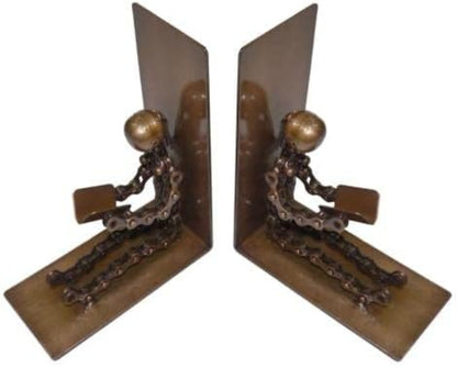 A pair of decorative metal bookends shaped like seated figures with chain-link legs and round metallic heads, shown on a plain white background.