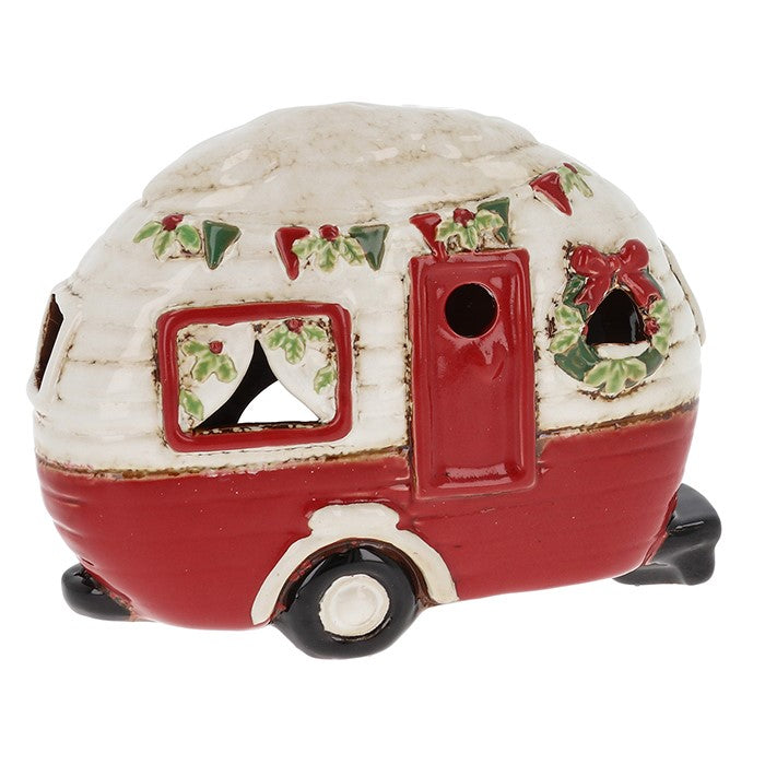 Decorative Christmas-themed camper figurine on a white background