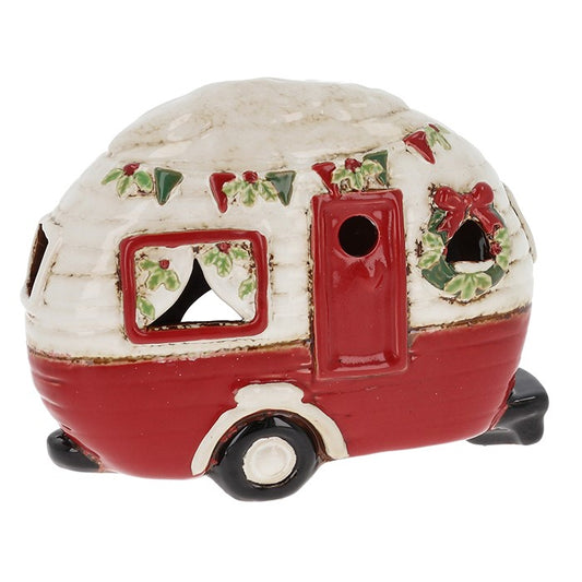 Decorative Christmas-themed camper figurine on a white background