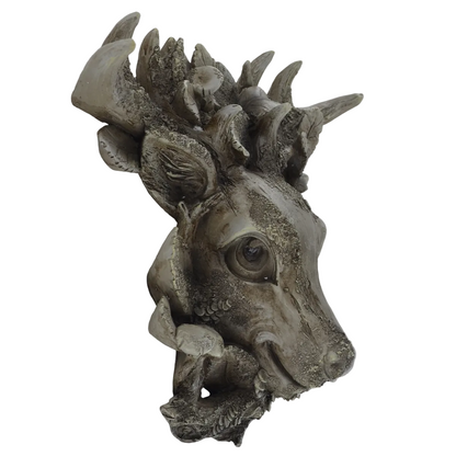 A sculptural wall-mounted deer head sculpture with textured, weathered gray and beige tones, photographed against a plain light gray background.