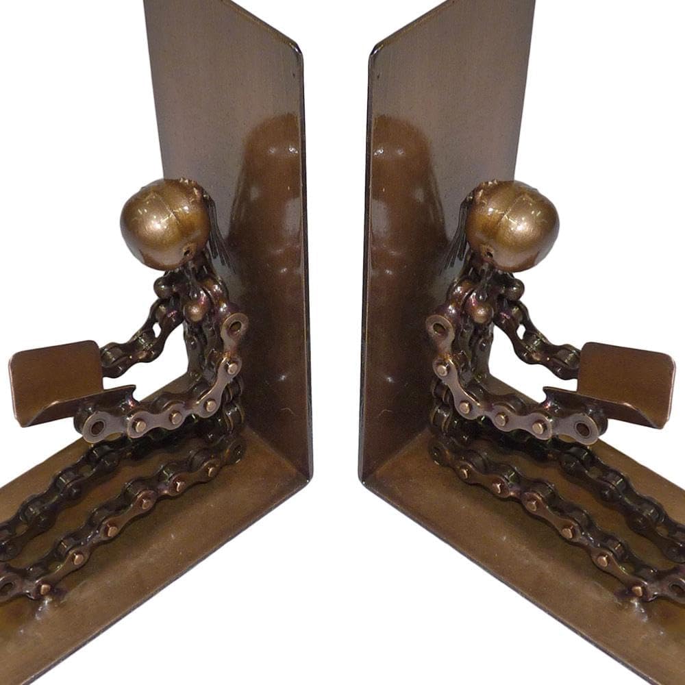 A pair of decorative metal bookends shaped like seated figures made from bicycle chains and spherical elements, shown on a plain white background.