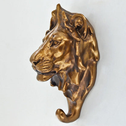 Bronze lion head sculpture on a white background