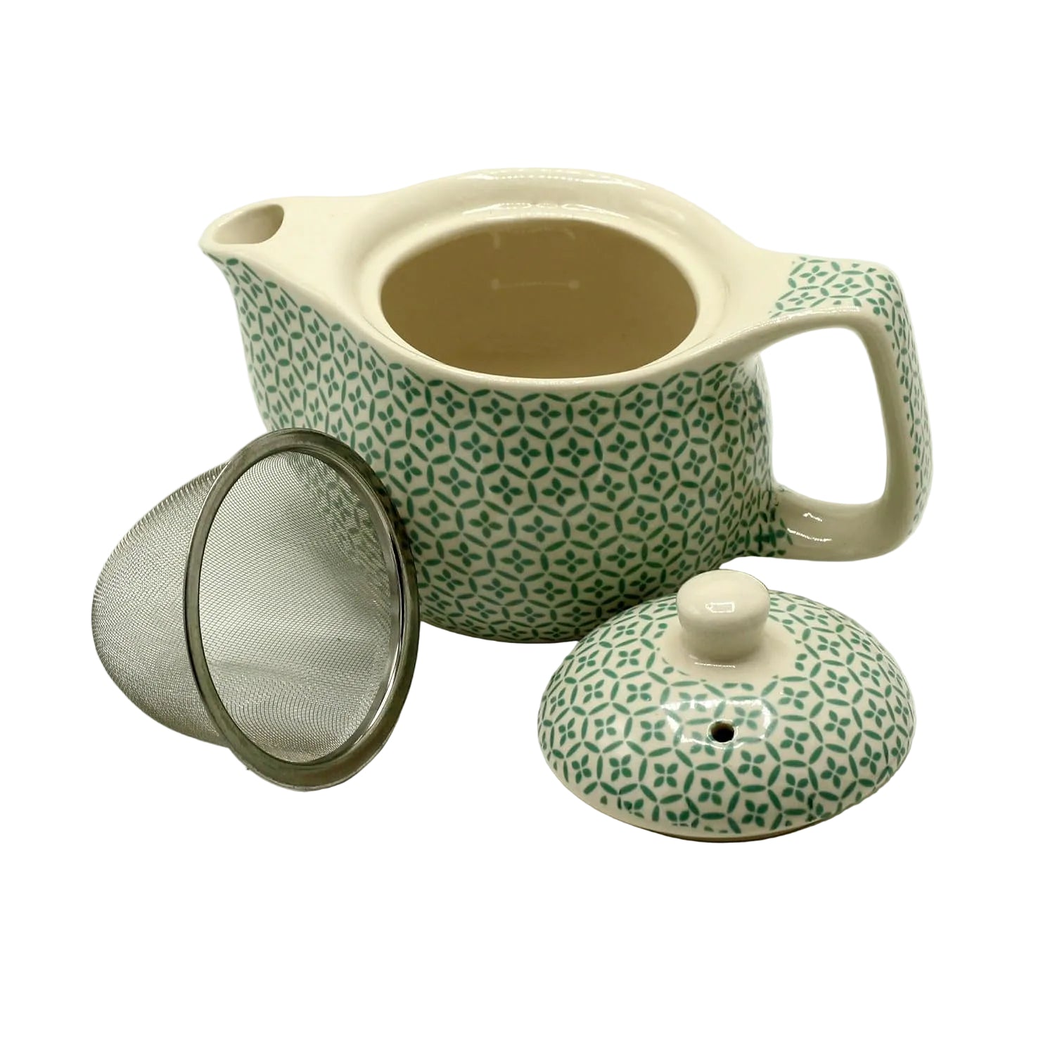 Ceramic teapot with green pattern, mesh filter, and lid on a white background