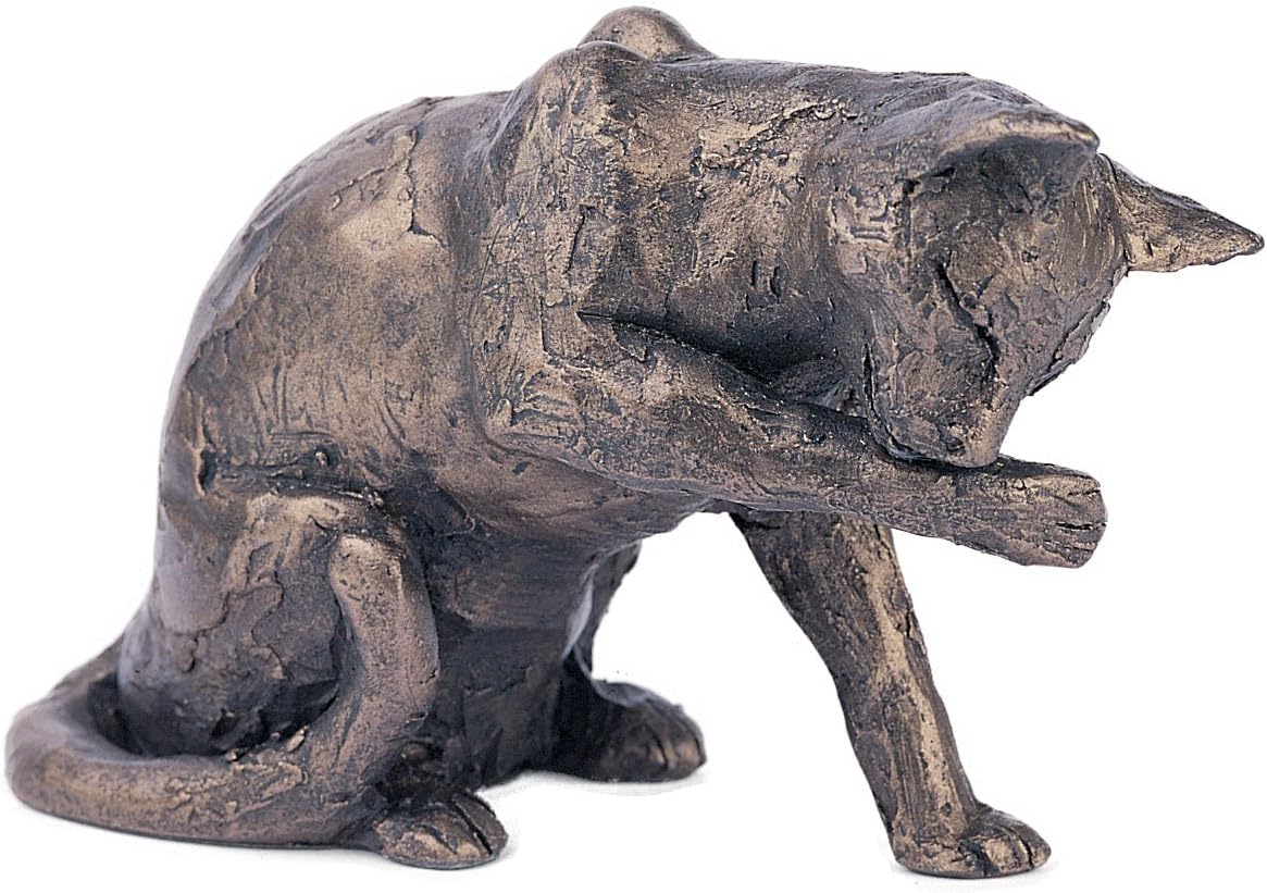 Bronze sculpture of a cat on a white background