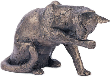 Bronze sculpture of a cat on a white background