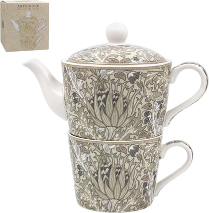 Teapot and mug set with floral design on a white background