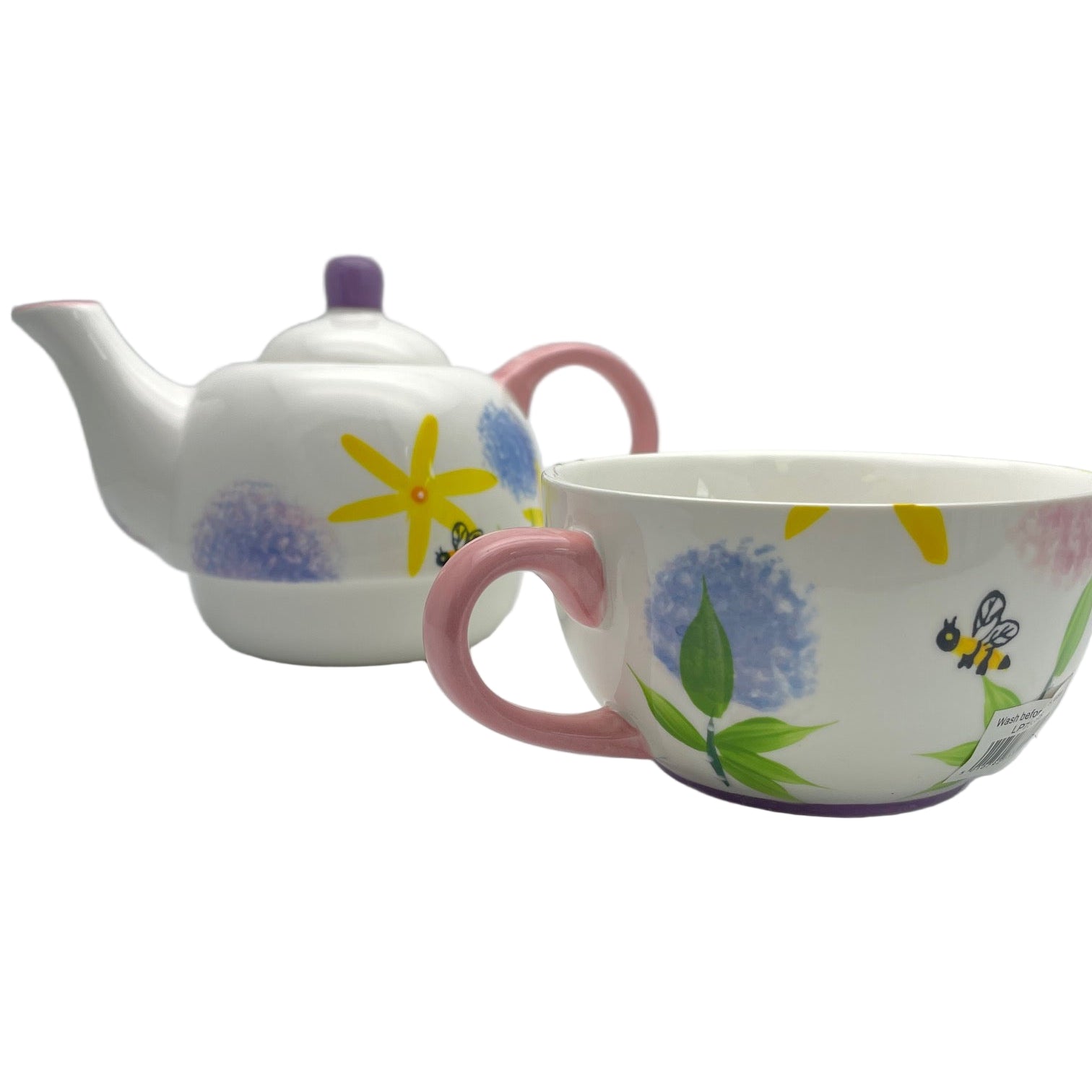 Ceramic teapot and mug set with floral and bee designs on a white background
