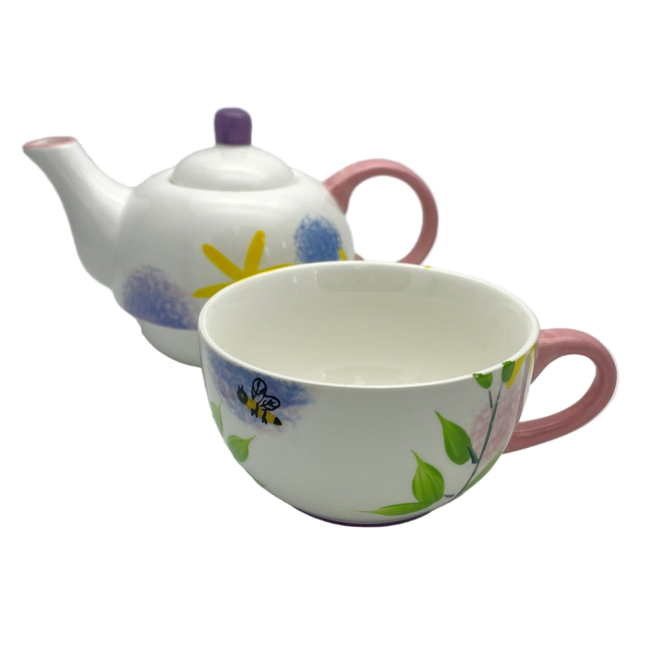 Ceramic teapot and cup with allium designs on a white background