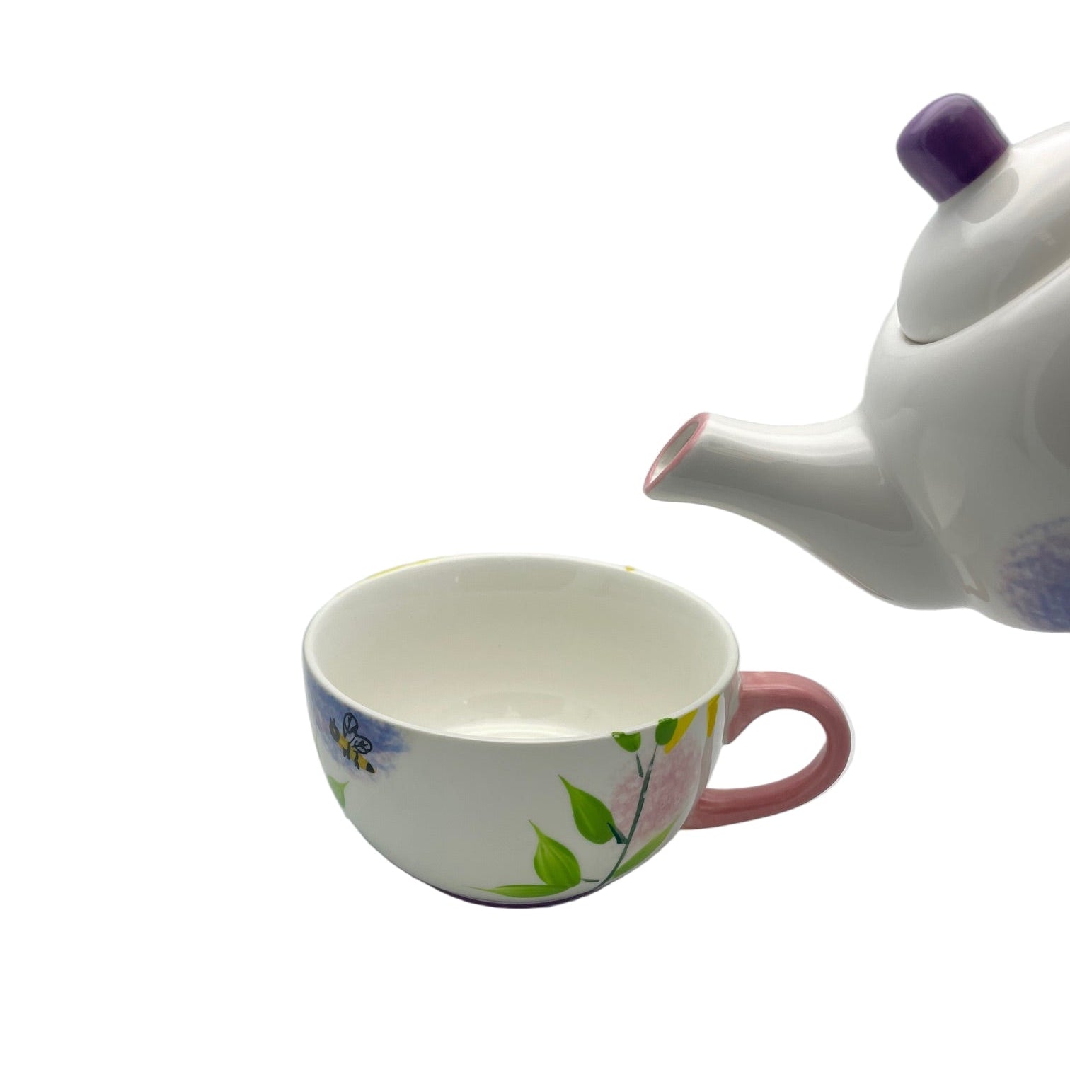Tea cup and teapot with floral design on a white background
