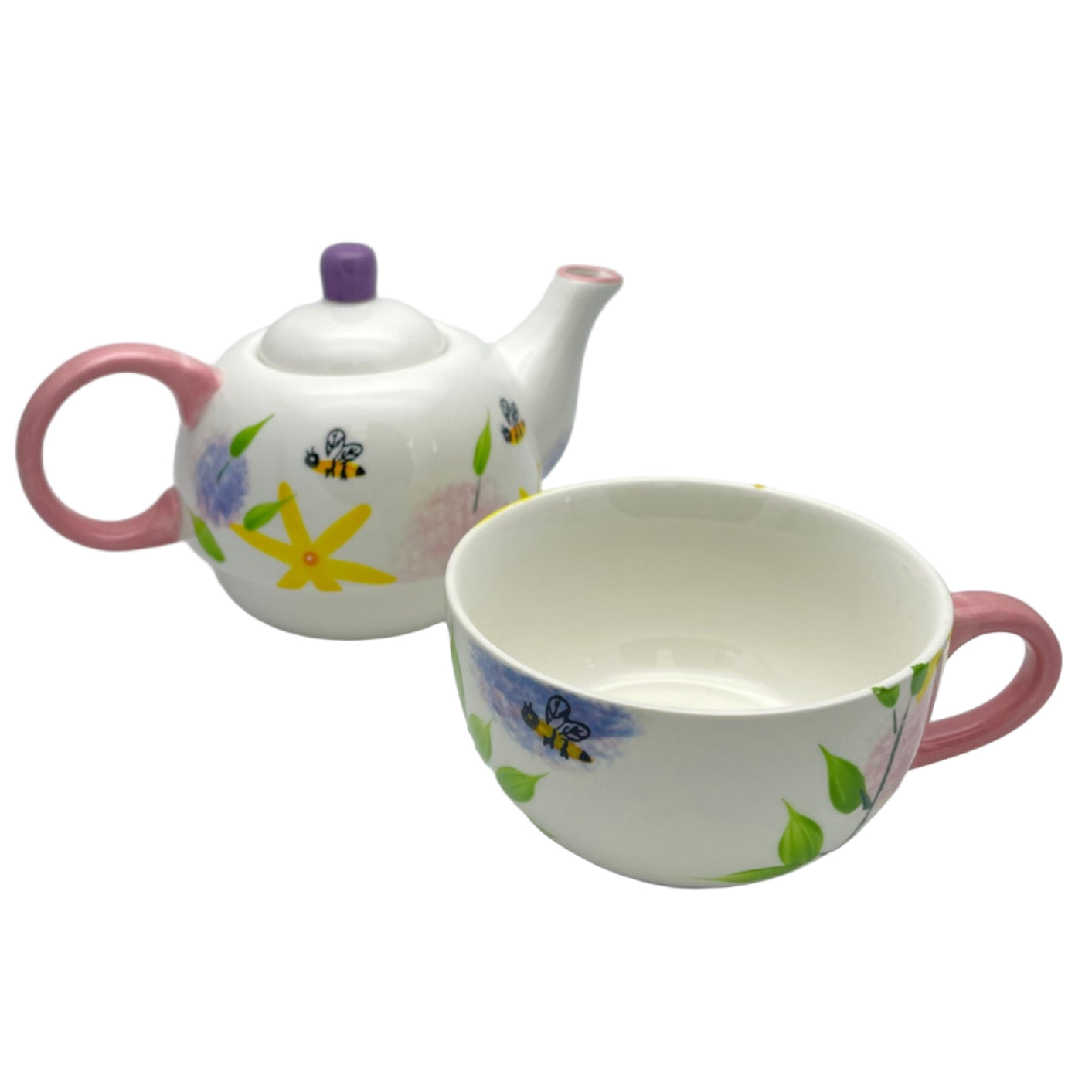 Decorative teapot and cup with floral design on a white background