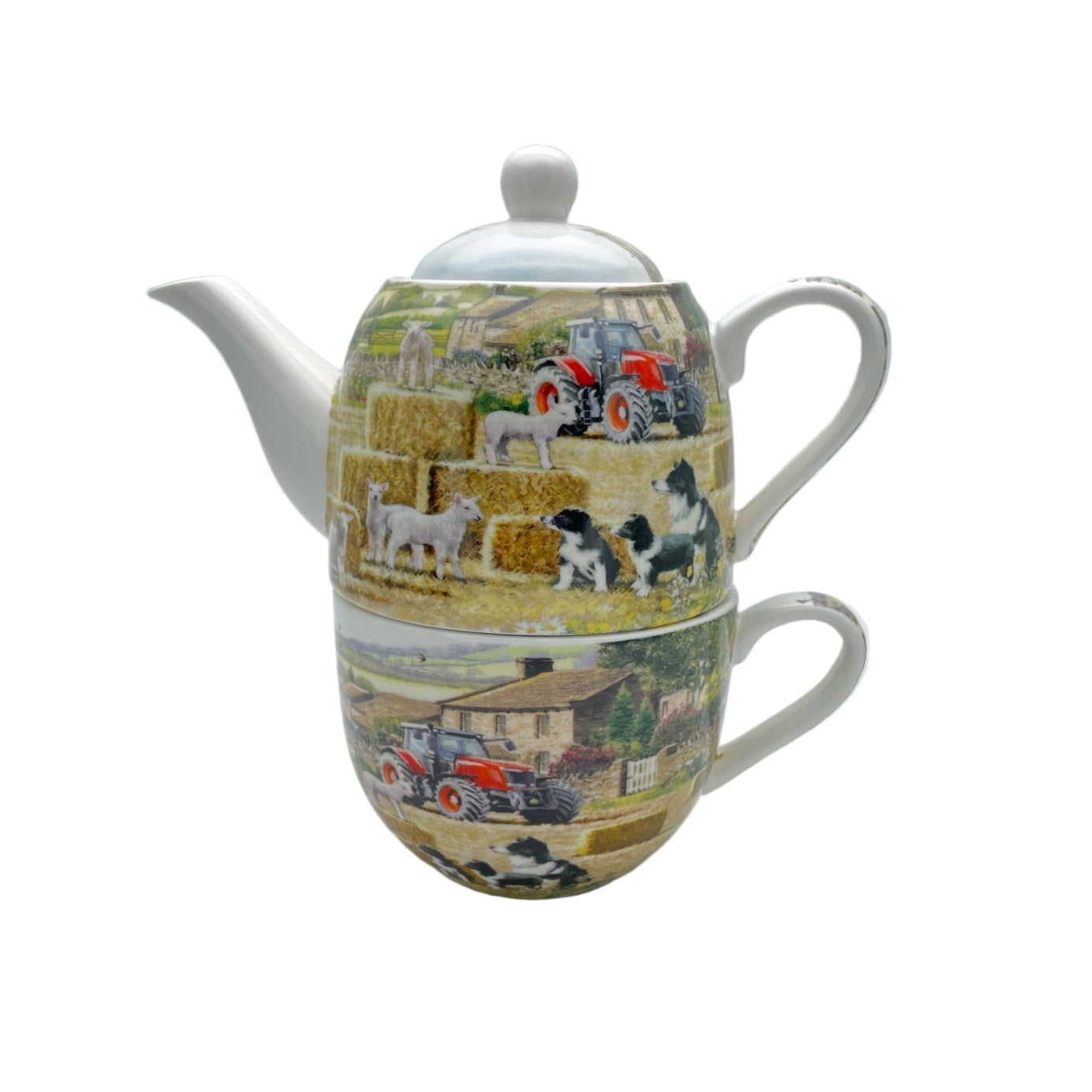 Teapot and mug set with farm scene design on a white background
