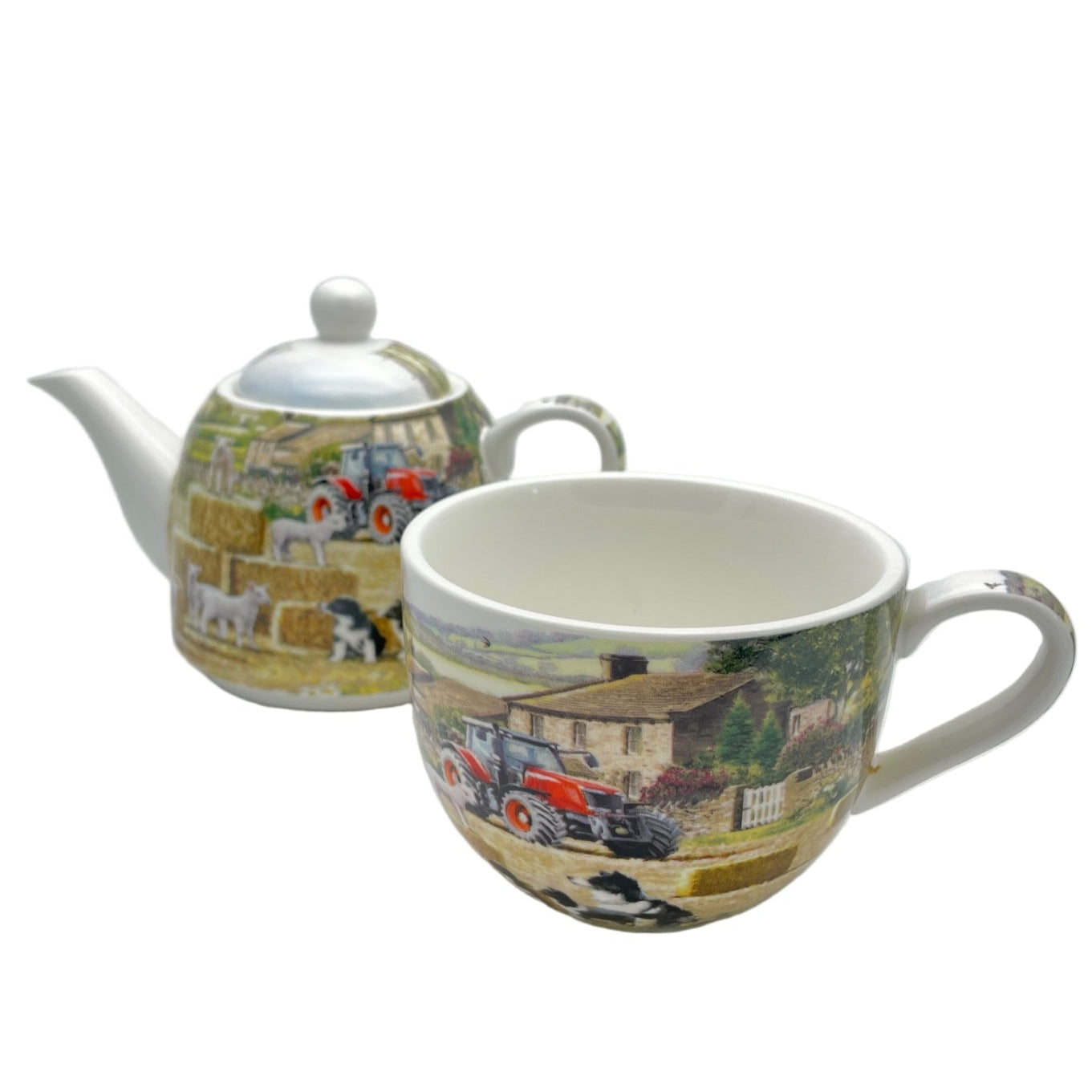 Teapot and mug set with farm scene design on a white background