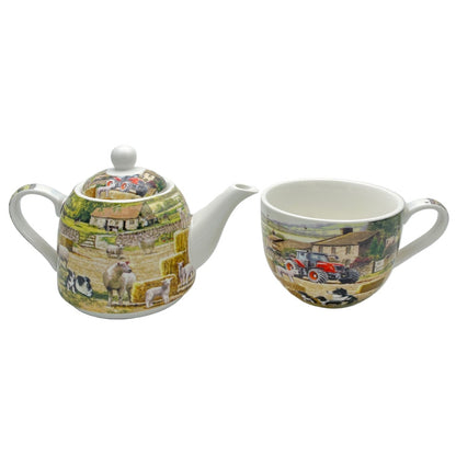 Teapot and mug set with farmyard and vintage tractor design on a white background