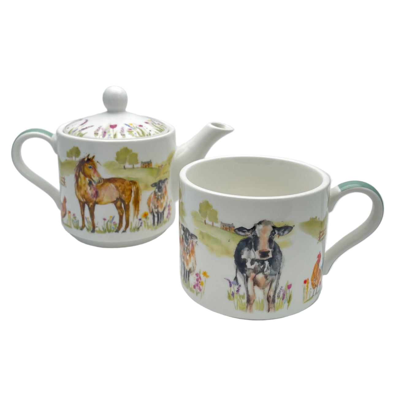 Teapot and mug set with farm animal design on a white background