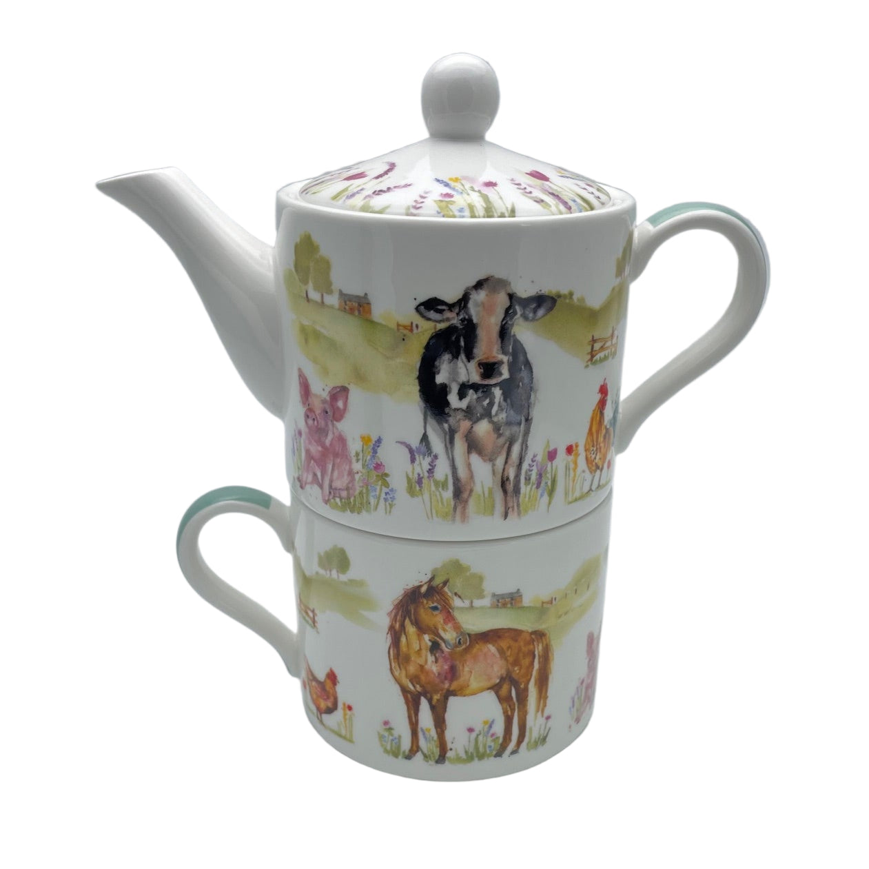 Teapot and mug set with farm animal design on a white background