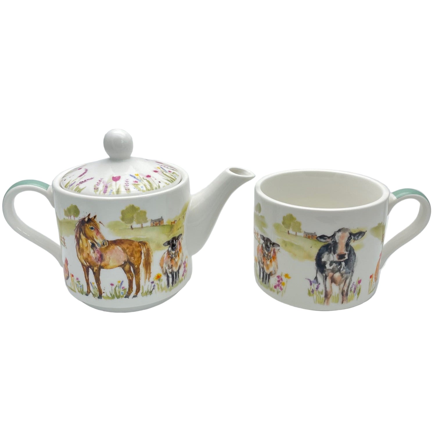 Teapot and mug set with farm animal design on a white background