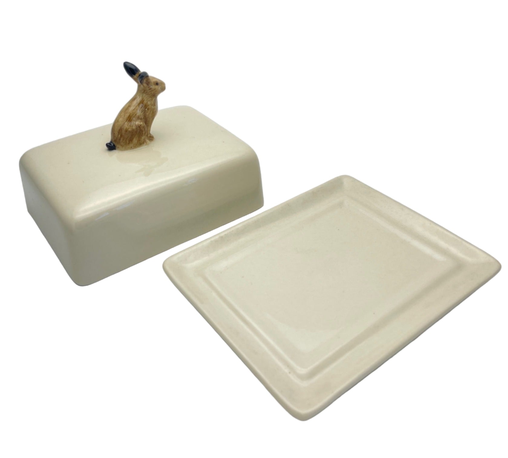 Ceramic butter dish with a small figurine of a rabbit on top
