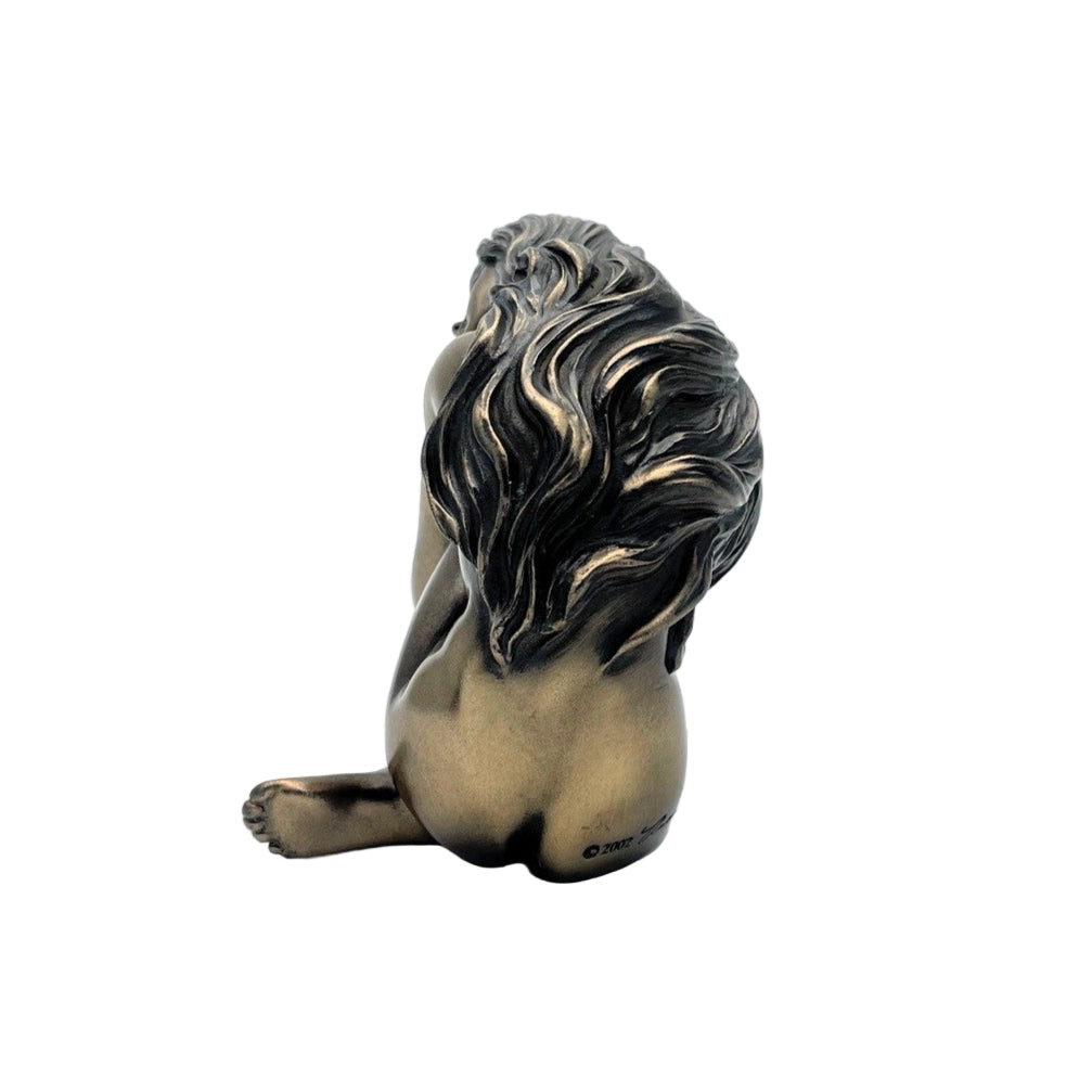 Bronze female statue on a white background