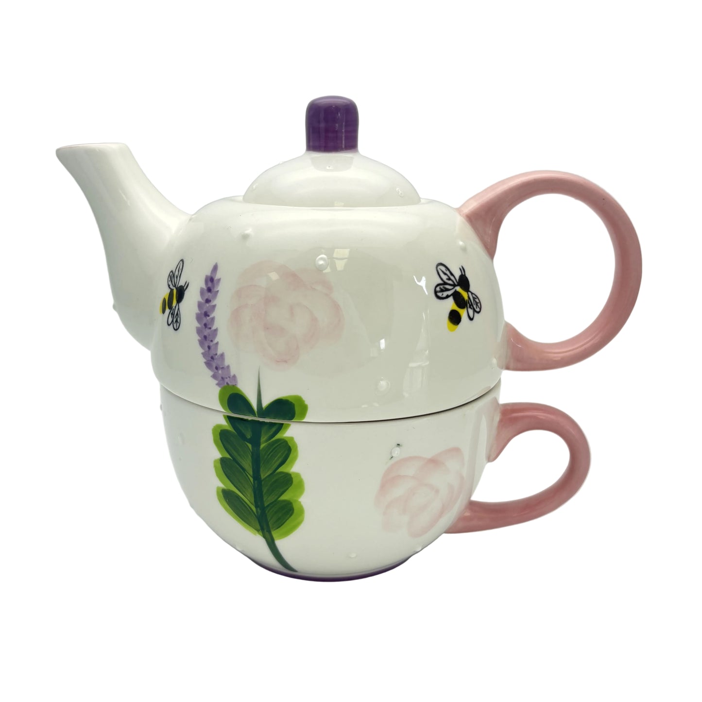 Ceramic teapot with floral and bee design on a white background