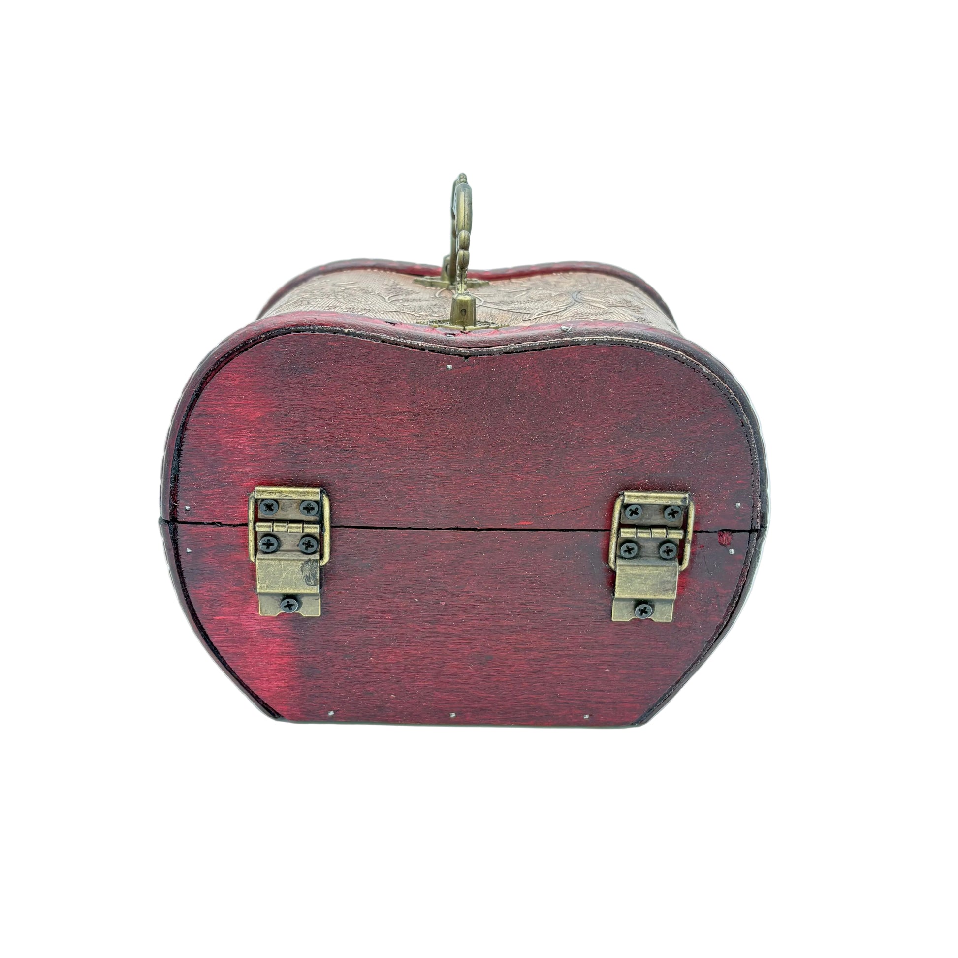 A small heart-shaped wooden keepsake box with a dark red painted exterior, brass latches, and a gold-tone hanging loop on top, photographed against a light blue studio background.