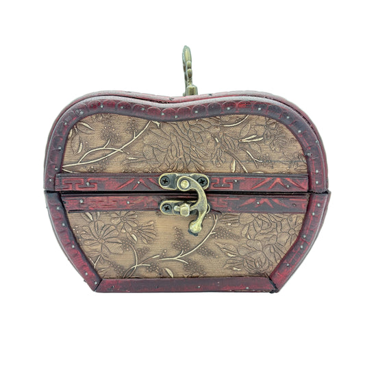 A heart-shaped wooden keepsake box with embossed floral patterns, dark red borders, and a brass clasp, shown on a light blue background.