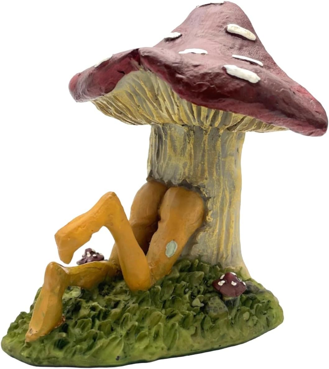 Pixie figurine sitting through a mushroom with a white background