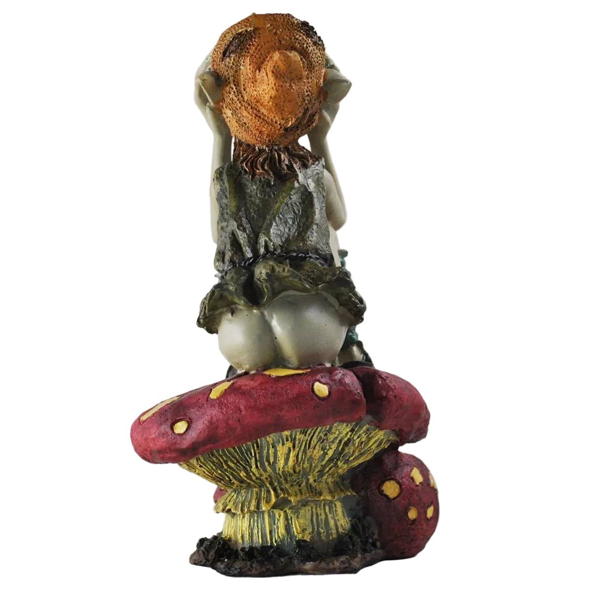 Decorative figurine of a pixie on a mushroom with a plain background