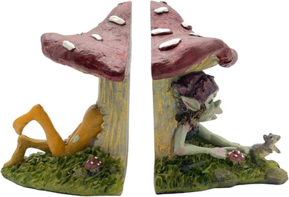 Two mushroom-shaped bookends with pixie sitting inside on a white background