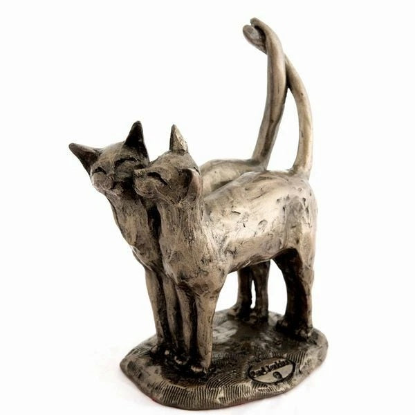 Bronze sculpture of two cats on a white background