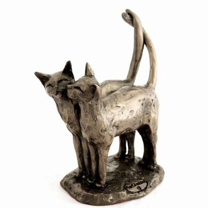 Bronze sculpture of two cats on a white background